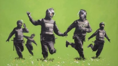 Banksy's “Beanfield” artwork showing riot police dancing in a meadow at Moco Museum Barcelona