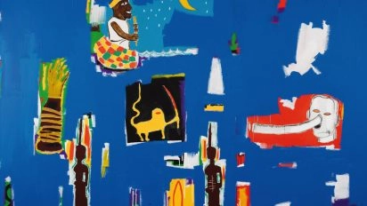 Jean-Michel Basquiat's colorful artwork “Antar” with symbolic and cultural elements on blue background at Moco Museum Barcelona
