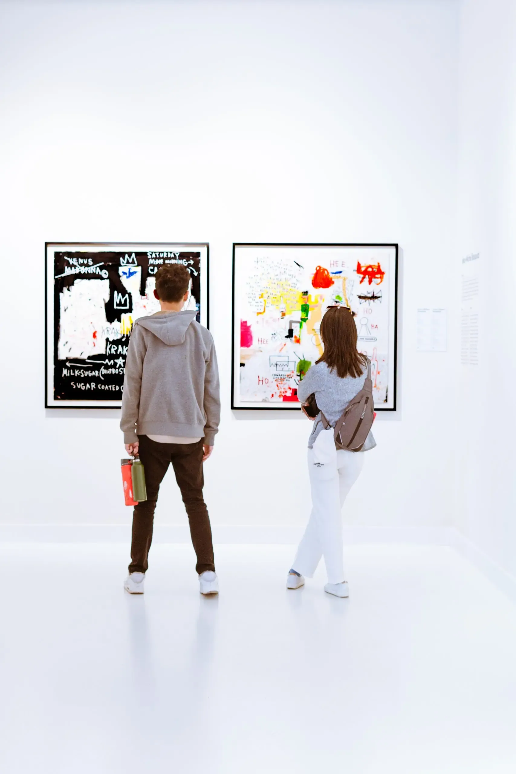 Visitors at Moco Museum with Basquiat artwork